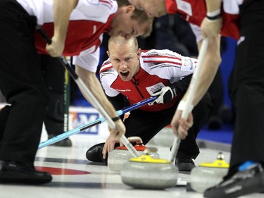 Colleen De Neve/ Calgary Herald CALGARY, AB --MARCH 1, 2015 -- Team Canada third Pat Simmons, centre, yelled to sweepers second Carter Rycroft, left, and lead Nolan Thiessen as they swept a shot by skip John Morris during their game against PEI at the Tim Hortons Brier at the Scotiabank Saddledome on March 1, 2015. (Colleen De Neve/Calgary Herald) (For Sports story by ) 00060855B SLUG: 0302-Brier