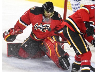 Calgary Flames goalie Jonas Hiller kept his eye on the puck after a shot by the Toronto Maple Leafs during third period NHL action at the Scotiabank Saddledome on March 13, 2015. The Flames defeated the Leafs 6-3.