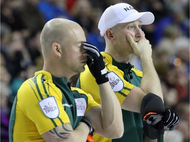 Northern Ontario's third Ryan Fry, left and second E.J. Harnden show their dismay as they see their chances slipping away in the gold medal final of  the 2015 Tim Hortons Brier on Sunday March 8, 2015. Team Canada downed Brad Jacobs' Northern Ontario team 6-5 in an extra end.
