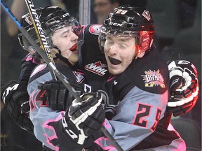 Calgary Hitmen rookie Layne Bensmiller, left, celebrates with linemate Radel Fazleev after scoring his second goal of the game in the third period against the Lethbridge Hurricanes on Sunday at the Scotiabank Saddledome. Calgary won 4-1.
