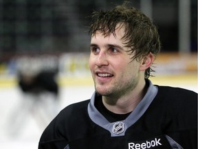 Calgary Flames defenceman Kris Russell smiles during practice at the Scotiabank Saddledome on Monday. The veteran will play his 500th NHL game on Tuesday and it will be against his old team, the St. Louis Blues.