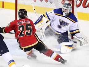 Calgary Flames forward Brandon Bollig bears down on St. Louis Blues goalie Brian Elliott during Tuesday's game.