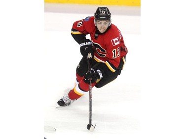 Calgary Flames left winger Johnny Gaudreau skated the puck down the ice against the Columbus Blue Jackets during second period NHL action at the Scotiabank Saddledome on March 21, 2015.