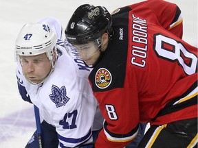 Calgary Flames centre Joe Colborne, seen battling Toronto Maple Leafs centre Leo Komarov during a game earlier this month, is the team's recipient of the Ralph T. Scurfield Humanitarian Award.