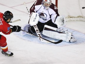 Calgary Flames forward David Jones scores on Colorado Avalanche goaltender Semyon Varlamov during the first period on Monday night.