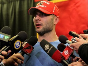 Calgary Flames captain Mark Giordano, seen meeting with the media earlier this month to announce his season was over, remains a key leadership figure behind the scenes for the young NHL club.