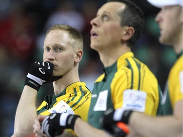 Northern Ontario skip Brad Jacobs, left, watched while standing along the boards with front end players E.J. Harnden and Ryan Harnden during the Wednesday afternoon draw against Saskatchewan during the Tim Horton's Brier at the Scotiabank Saddledome on March 4, 2015.