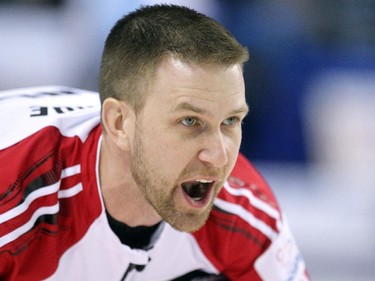 Newfoundland/Labrador skip Brad Gushue called to his sweepers as he watched from the house during their game against the Northwest Territories at the Tim Hortons Brier at the Scotiabank Saddledome on March 1, 2015.