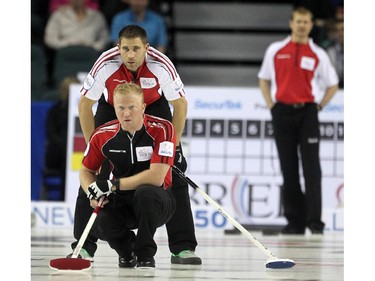 Team Canada's John Morris stood behind Ontario lead Scott Howard as his shot slid down the ice during the afternoon draw at the Tim Hortons Brier at the Scotiabank Saddledome in Calgary on March 4, 2015.
