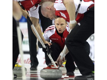 Team Canada skip Pat Simmons called to his sweepers from a house full of B.C's yellow rocks during the Wednesday morning draw of the Tim Horton's Brier at the Scotiabank Saddledome on March 4, 2015. Team Canada scored 2 in the final end to defeat B.C. 8-7.