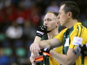 Northern Ontario skip Brad Jacobs, left, watched while standing along the boards with front end player E.J. Harnden during the Wednesday afternoon Brier draw against Saskatchewan. With a 5-3 win, the rink ran their record to 9--0.