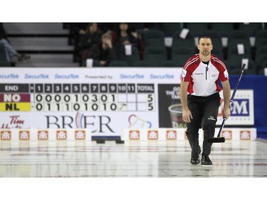 Newfoundland Labrador skip Brad Gushue kept an eye on his final shot the game which captured the 6-5 win over Northern Ontario during the morning draw of the Tim Hortons Brier at the Scotiabank Saddledome in Calgary on March 5, 2015. The win by Newfoundland Labrador dealt Northern Ontario its first loss of the Brier.