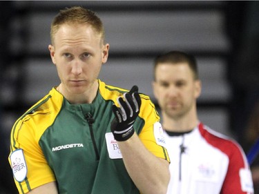 Northern Ontario skip Brad Jacobs asked his front end about shot during the morning draw against Newfoundland Labrador during the Tim Hortons Brier at the Scotiabank Saddledome in Calgary on March 5, 2015. Newfoundland Labrador won 6-5 handing Northern Ontario its first loss of the Brier.