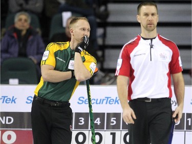 Northern Ontario skip Brad Jacobs peered off to another game while waiting for his teams shot during the morning draw against Newfoundland Labrador during the Tim Hortons Brier at the Scotiabank Saddledome in Calgary on March 5, 2015. Newfoundland Labrador won 6-5 handing Northern Ontario its first loss of the Brier.