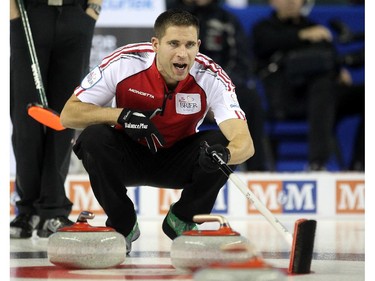 Team Canada skip John Morris called to his sweepers during their game against PEI at the Tim Hortons Brier at the Scotiabank Saddledome on March 1, 2015.