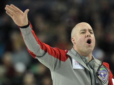 Northwest Territories skip Jamie Koe yelled for his sweepers to stop during the afternoon draw against PEI at the Tim Hortons Brier at the Scotiabank Saddledome in Calgary on March 5, 2015.