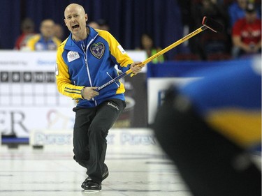 Alberta skip Kevin Koe screamed to his sweepers as they carried his shot down the ice against Saskatchewan during the afternoon draw at the Tim Hortons Brier at the Scotiabank Saddledome in Calgary on March 5, 2015.