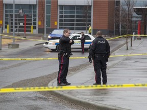 Police investigate a death outside the Begin residence tower on Dr. Carpenter Circle Drive at SAIT Polytechnic in Calgary, on March 21, 2015.