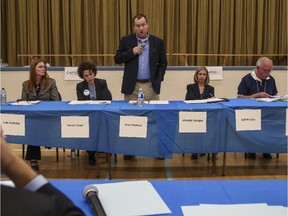 Crystal Schick/ Calgary Herald CALGARY, AB -- Moderators watch as Ward's 11 and 13 2015 CBE trustee candidates, Julie Hrdlicka, from left, Karen Lloyd, Sean McAsey, Victoria Morgan, and Wilf Phillips, talk at a public forum in Calgary, on March 31, 2015. --  (Crystal Schick/Calgary Herald) (For City story by  Erika Stark) 00063900A