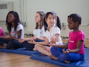 Students at Mountain View Academy participate in mindfulness education, which includes art and yoga classes to reduce stress.