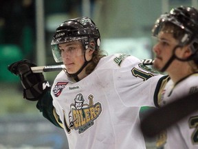 Mitch Collett, left, leaves the ice dejected after the Okotoks Oilers lost in Game 7 of their playoff series to the Brooks Bandits two years ago. The Bandits went on to win the national championship after narrowly avoiding an upset at the hands of the Oilers that season. Collett and the Oilers will square off against Brooks again starting on Friday, in Game 1 of the South Division semifinal.