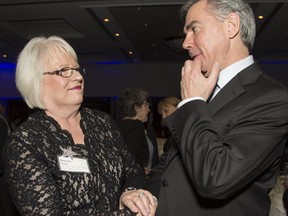 Sharon Carry, CEO and president of Bow Valley College, talks with Premier Jim Prentice at WXN Canada's Most Powerful Women: Top 100 Awards, at the Westin in Calgary, on March 4, 2015.