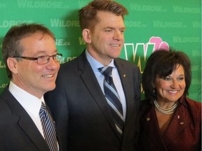 Wildrose leadership candidates, from left, Drew Barnes, Brian Jean and Linda Osinchuk speak to the media on Feb. 28, 2015, after addressing party members at a pre-election meeting in Edmonton.