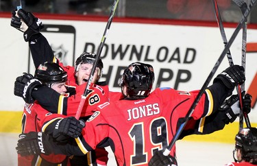 Calgary Flames Matt Stajan, middle, celebrates his goal on Vancouver Canucks with teammates during game 6 of the NHL Playoffs.