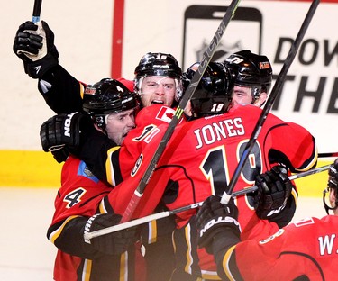 Calgary Flames Matt Stajan, middle, celebrates his goal on Vancouver Canucks with teammates during game 6 of the NHL Playoffs at the scotiabank Saddledome in Calgary.