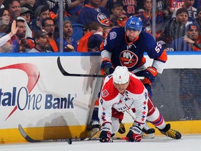 New York Islanders defenceman Johnny Boychuk knocks down Washington Capitals star Alex Ovechkin during the second period of Game 3 of their Eastern Conference quarter-final series at the Nassau Veterans Memorial Coliseum in Uniondale, N.Y., on Sunday, April 19, 2015.