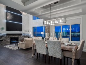 The dining area and great room in the Kimberley show home, by Homes By Us in Aspen Woods Estates.