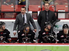 Calgary Hitmen head coach Mark French screams at the referees after a call during the third period of Game 1 against Brandon on Friday. He later tossed a stick onto the ice, which earned him the gate and a fine.