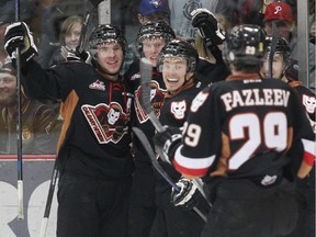 The Calgary Hitmen celebrate a goal by Michael Zipp during Game 2 against the Brandon Wheat Kings on Saturday night. Calgary played much better, but still lost, 3-2 in overtime.