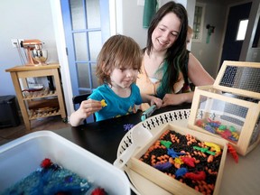 CALGARY.;  APRIL 21, 2015  -- Calgary mom Heather Howse  makes sensory bins for her son Frey, age 2, and son Rhys, 7 months. Photo Leah Hennel, Calgary Herald  (For Lifestyles story by Lisa Kadane)