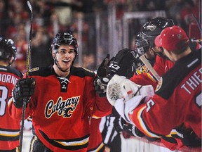 Sean Monahan celebrates his game-winning goal with the bench after scoring against the Arizona Coyotes in the third period on Tuesday.