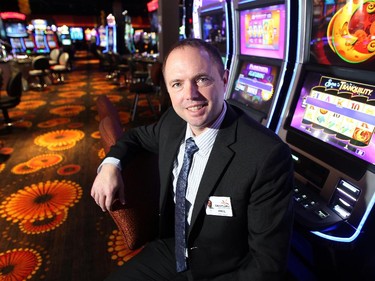 Century Downs General Manager Raul Ryneveld sat at a row of slot machines prior to the official opening of the new Century Downs Casino and Racetrack in Balzac on April 1, 2015.