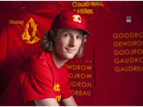 Flames fan Brennan Plumb poses with T-shirts that he's printed on Wednesday, April 29, 2015.