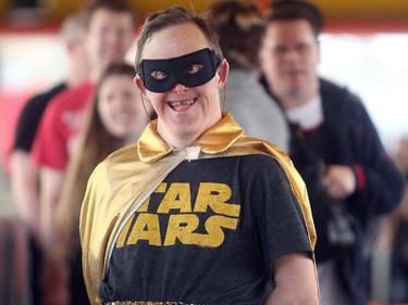 Comic fan Glen Kelly, decked out in a combination Robin  and Star Wars getup, waits in line for the opening of the Calgary Comic and Entertainment Expo Thursday April 16, 2015 at the BMO Centre.