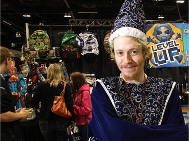 Derrick Clayton wears his Merlin wizard costume at the Level Up booth on opening night of the 2015 Calgary Comic and Entertainment Expo Thursday April 16, 2015 at the BMO Centre.