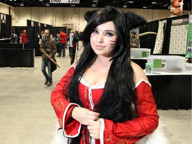 Parker Schurek-Bell wears her Ahri costume, from League of Legends video game, just as the gates open on the 2015 Calgary Comic and Entertainment Expo Thursday April 16, 2015 at the BMO Centre.