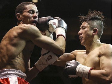 Lightweights Roxie Lam, right, makes contact with Wayne Smith's face at the Teofista boxing series 15 in Calgary, on April 3, 2015. Lam won the bout.
