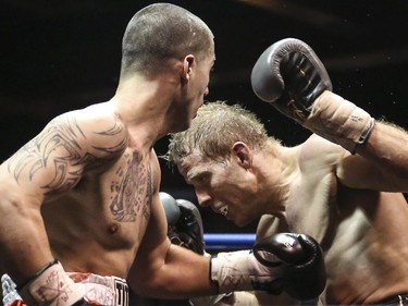 Light Heavyweight Elvis Vukaj, left, makes contact with Nick Ring's face at the Teofista boxing series 15 in Calgary, on April 3, 2015. Ring won the bout.