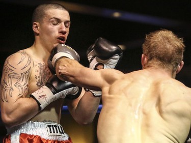 Light Heavyweight Elvis Vukaj takes a jab to the jaw from Nick Ring at the Teofista boxing series 15 in Calgary, on April 3, 2015. Ring won the bout.