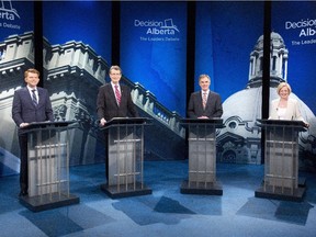 From left Wildrose Party leader Brian Jean, Liberal leader David Swann, Alberta Progressive Conservative leader Jim Prentice and NDP leader Rachel Notley stand for a photo op before leaders debate in Edmonton on Thursday, April 23, 2015.