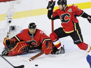 Calgary Flames goaltender Jonas Hiller stopped this scoring chance in the closing minutes against he Vancouver Canucks during NHL playoff  game 4 action at the Scotiabank Saddledome. Calgary won 3-1.