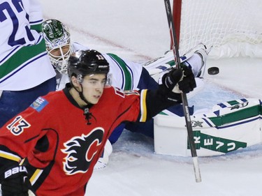 Johnny Gaudreau celebrates a goal against Canucks goalie Eddie Lack in the first period of Game 4 on Tuesday night. The Canucks are down to their last playoff life after losing 3-1 to Calgary on Tuesday.