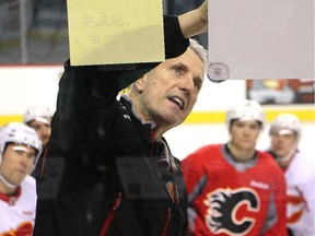 Calgary Flames head coach Bob Hartley maps out the strategy for his players at practice Monday April 13, 2015 before game one of the first round of the playoffs vs. the Vancouver Canucks.