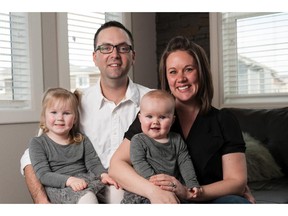 Benjamin and Jennifer Wood with  Paisley and Elliott in their new home in Ravenswood. Don Molyneaux.