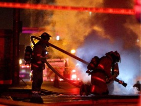 Fire crews on the scene of an underground electrical fire near 5th ave and 8 St SW in Calgary on October 11, 2014.