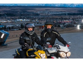 Desirae Bowlby and Alex Presse on their motorcycles in Cochrane.